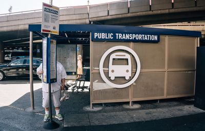 Low angle view of man standing on bus