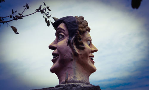 Low angle view of statue against sky