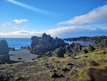 Panoramic view of landscape and sea against sky