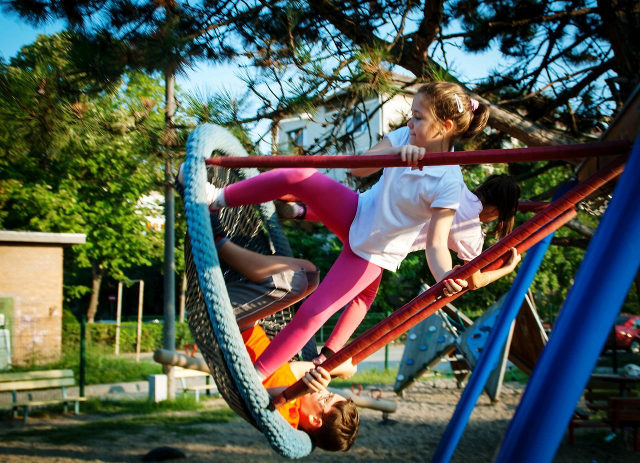 child, playground, childhood, full length, monkey bars, children only, people, real people, climbing, jungle gym, outdoor play equipment, outdoors, tree, adventure, day, one person, adult