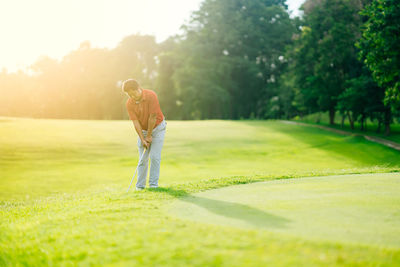 Full length of man on golf course