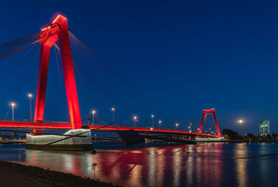 Golden gate bridge over river against sky