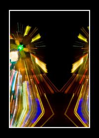 Illuminated lights against sky at night