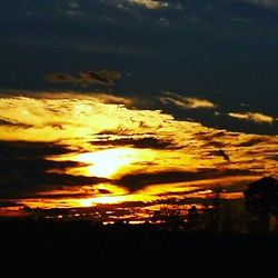 Scenic view of dramatic sky during sunset