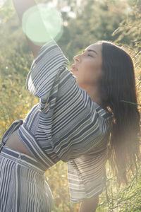 Long haired latina in afternoon sun and fields
