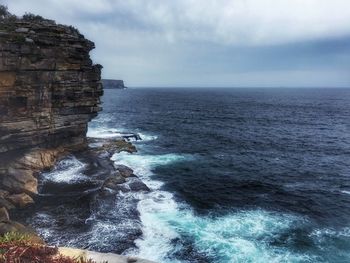 Scenic view of sea against cloudy sky
