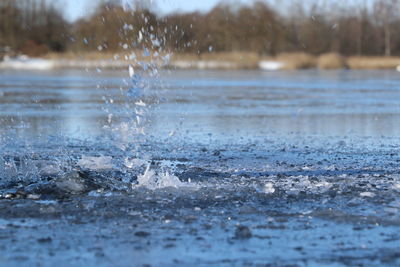 Close-up of water splashing in sea