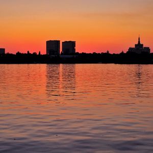 Silhouette of city at sunset