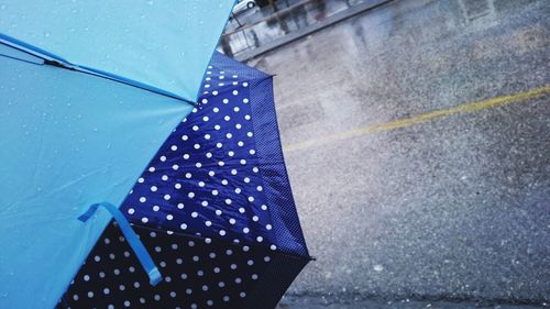 Cropped image of umbrellas
