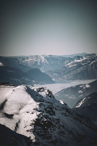 Scenic view of snowcapped mountains against sky