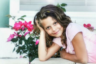 Portrait of young woman holding flower