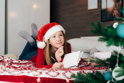 Portrait of woman wearing hat at home