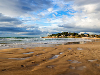 Scenic view of sea against cloudy sky