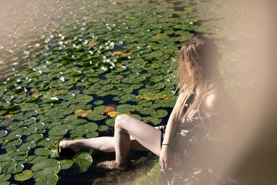 Woman sitting in water