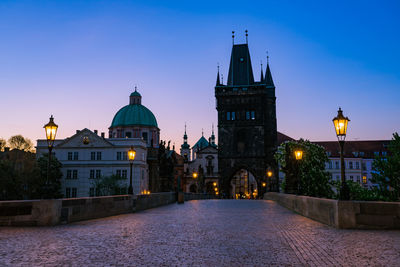 View of buildings in city at dusk