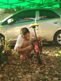 Man repairing bicycle