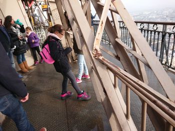 People walking on bridge