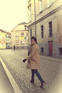 Woman standing in city