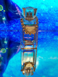 Close-up of glass bottle on table