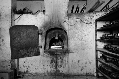 Rear view of woman standing in abandoned building