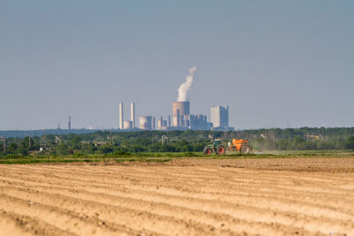 Panoramic view of factory against clear sky