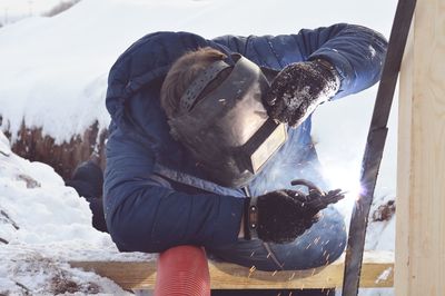 View of dog on snow covered landscape