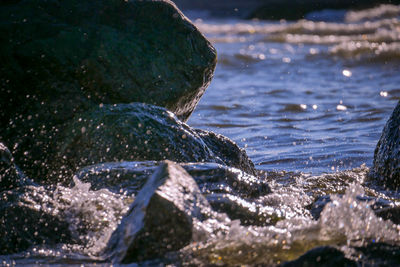 Close-up of water flowing through rocks