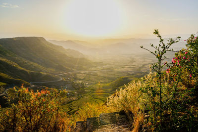 Scenic view of mountains against sky during sunset