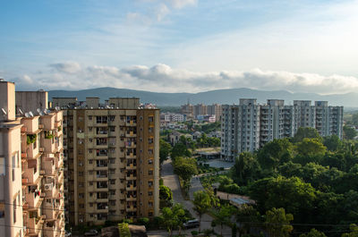 High angle view of buildings in city against sky