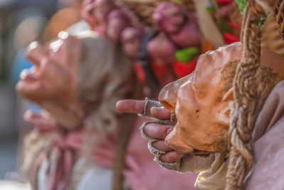 Cropped hands of person with mask wearing fingerless glove outdoors