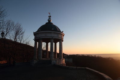 View of historic building against sky during sunset