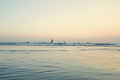 Scenic view of sea against sky during sunset