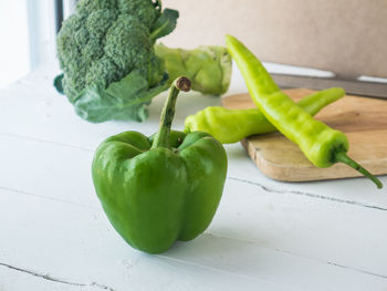 Close-up of green fruits on table