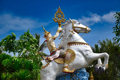 Low angle view of statue against sky