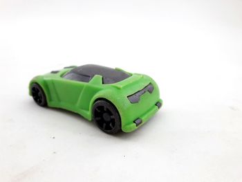Close-up of green toy car on white background