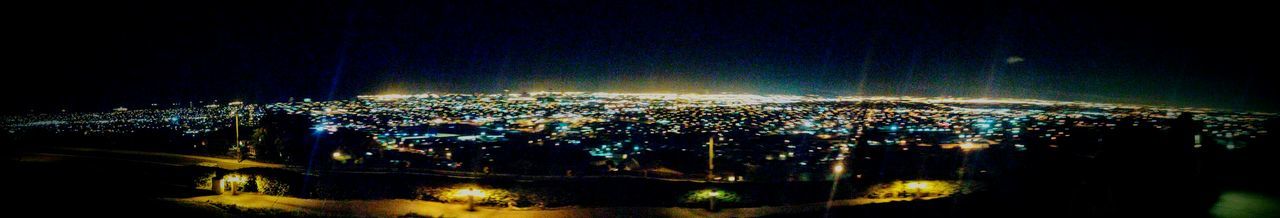 Illuminated cityscape at night