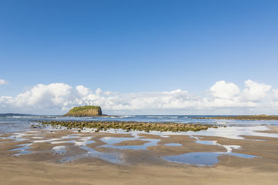 Scenic view of beach against sky