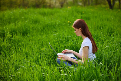 Portrait of young woman using mobile phone