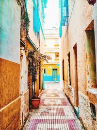 Narrow alley amidst buildings in town