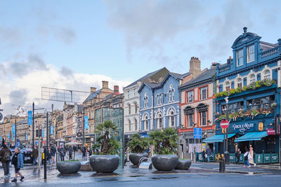 Buildings in city against sky