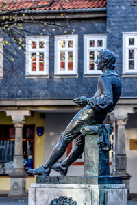 Low angle view of statue against building, johann sebastian bach, arnstadt 