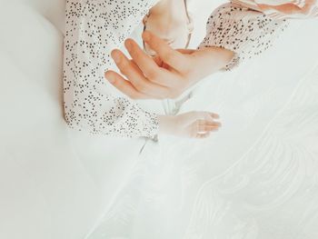 Directly below shot of woman by curtain