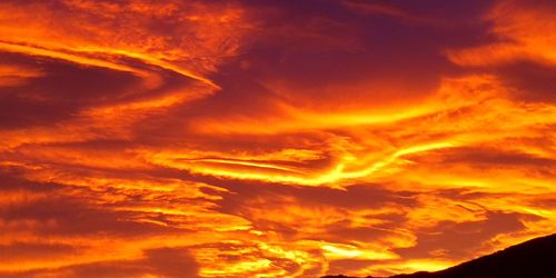 Low angle view of dramatic sky during sunset