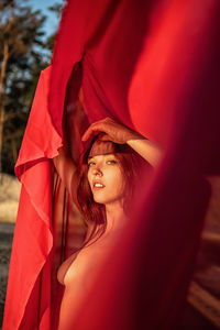 Portrait of young woman with umbrella