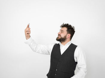 Man looking at camera over white background