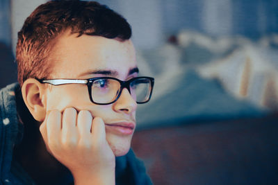 Close-up of young woman looking away