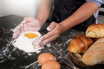 Midsection of man making food