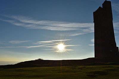 Silhouette landscape against sky