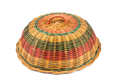 Close-up of wicker lid on white background