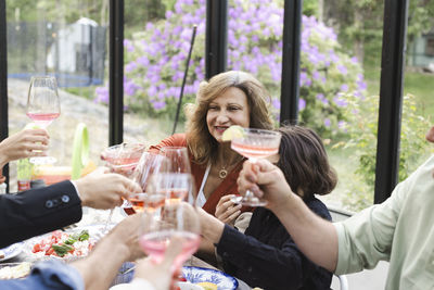 Family toasting while enjoying dinner party